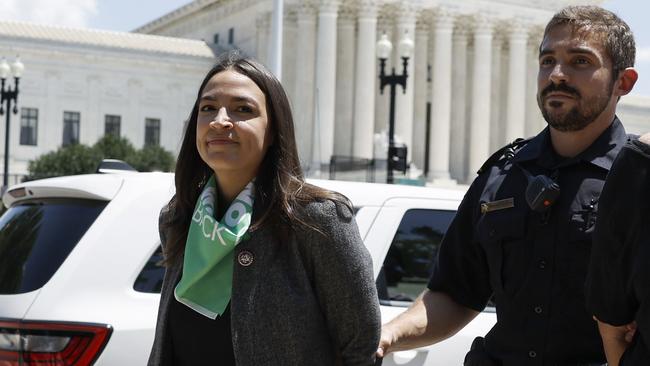 Alexandria Ocasio-Cortez is detained by US Capitol Police Officers after participating in an abortion rights protest. Picture: AFP.