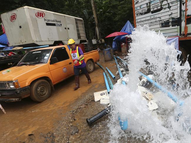 Water pumped from the flooded cave during the rescue mission. Picture: AP/Sakchai Lalit.