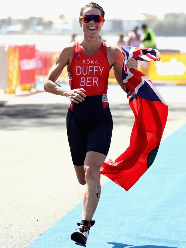 Flora Duffy of Bermuda celebrates on her way to winning gold in the women's triathlon. Photo: Getty Images