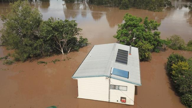 A house is seen surrounded by flood waters from the Mary River in the town of Tiaro, 198 kilometres north of Brisbane in January 2022.