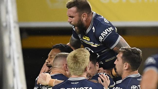 TOWNSVILLE, AUSTRALIA - JUNE 18:  Francis Molo of the Cowboys celebrates after scoring a try  during the round 15 NRL match between the North Queensland Cowboys and the Cronulla Sharks at QCB Stadium, on June 18, 2021, in Townsville, Australia. (Photo by Ian Hitchcock/Getty Images)