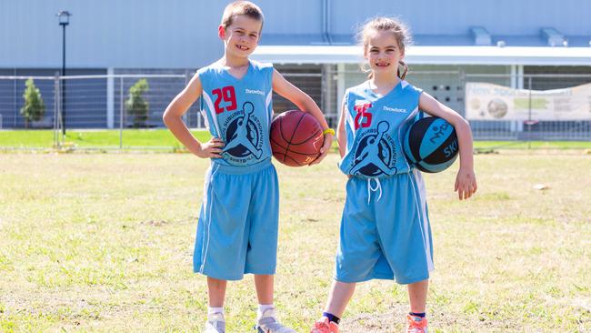 Gus and Molly Ammit outside the new basketball stadium at Perry Park in Alexandria. Picture: Jordan Shields.