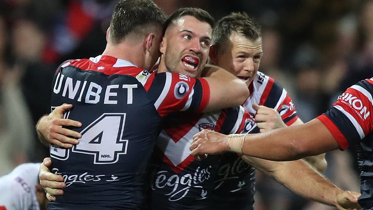 Roosters James Tedesco celebrates after scoring a try