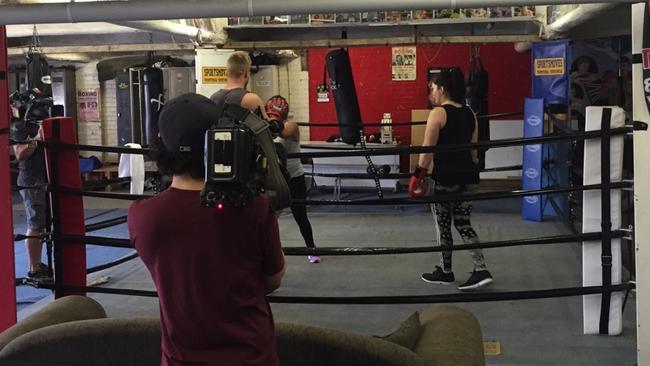 A scene from a gym boxing ring is filmed for the pilot.