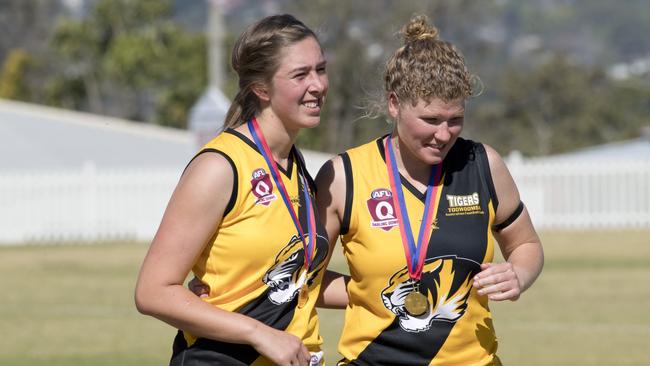 <s1>HAPPIER TIMES: Lauren Jericho (left) celebrates the Toowoomba Tigers grand final victory over University last year. </s1> <ld pattern=" "/> <source>Picture: Nev Madsen</source>