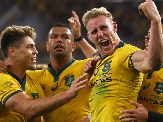 PERTH, AUSTRALIA - AUGUST 10: Reece Hodge of Australia (C) celebrates his try during the 2019 Rugby Championship Test Match between the Australian Wallabies and the New Zealand All Blacks at Optus Stadium on August 10, 2019 in Perth, Australia. (Photo by Cameron Spencer/Getty Images)