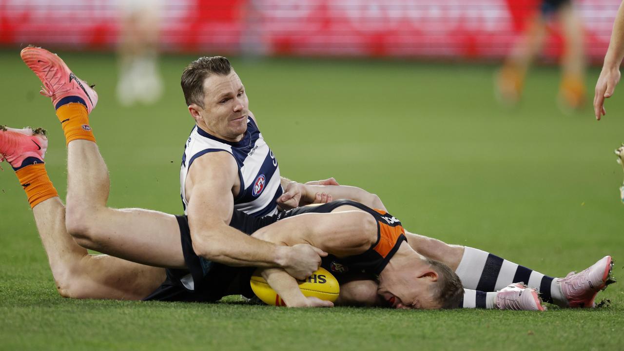 Sam Walsh of the Blues gets tackled into the turf by Patrick Dangerfield of the Cats during the first quarter. Pic: Michael Klein