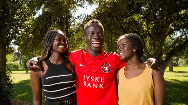 Adelaide United star Awer Mabil with his sister Bor Mabil (R) and cousin Abiei Ajak in Adelaide. Bor Mabil died in a high-speed crash in January 2019. Picture: James Elsby/The Australian