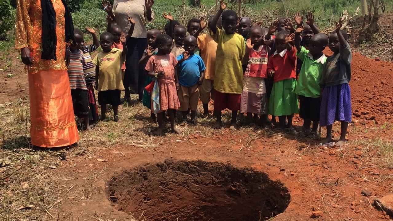 One of the wells already built, pictured with construction beginning, in Uganda thanks to Little Ripples.