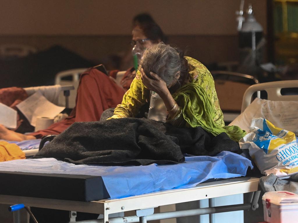 A patient rests inside a banquet hall temporarily converted into a coronavirus ward in New Delhi. Picture: AFP