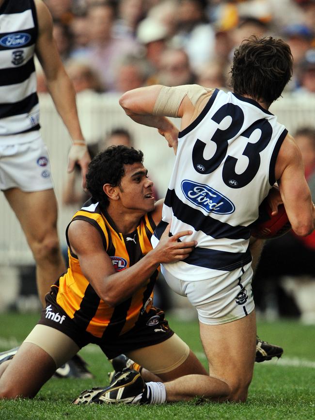 Cyril Rioli takes on Geelong’s Max Rooke in the 2008 Grand Final.