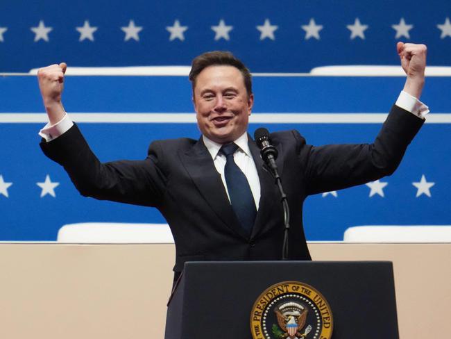 WASHINGTON, DC - JANUARY 20: Tesla, SpaceX and X CEO Elon Musk gestures while speaking during an inauguration event at Capital One Arena on January 20, 2025 in Washington, DC. Donald Trump takes office for his second term as the 47th president of the United States.   Christopher Furlong/Getty Images/AFP (Photo by Christopher Furlong / GETTY IMAGES NORTH AMERICA / Getty Images via AFP)