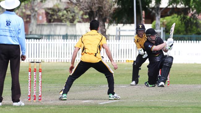 Penrith first grade cricket team play University of the NSW at Howell Oval, Penrith.Tim Cummins sweeps for four