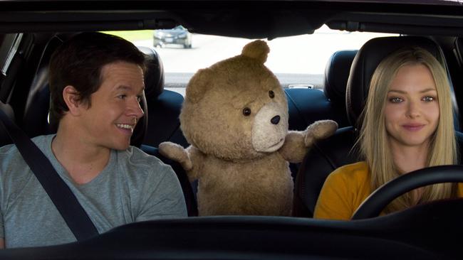 More crass jokes ... Mark Wahlberg, the character Ted, voiced by Seth MacFarlane and Amanda Seyfried in Ted 2. Picture: Universal Pictures via AP