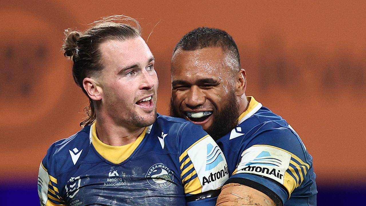 SYDNEY, AUSTRALIA – JUNE 13: Clinton Gutherson of the Eels celebrates with Junior Paulo after scoring a try during the round 14 NRL match between the Parramatta Eels and the Wests Tigers at Bankwest Stadium, on June 13, 2021, in Sydney, Australia. (Photo by Cameron Spencer/Getty Images)