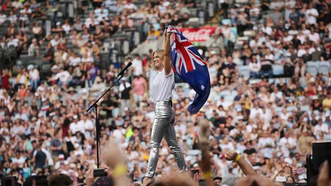 Delta Goodrem flies the flag at the Fire fight Australia concert. Picture: Richard Dobson