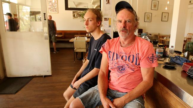 Andrew Clarke, with his son, lost part of his winery in the bushfires. Picture: Stuart McEvoy