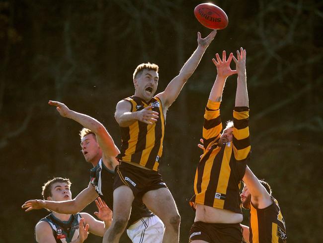 NFL: Nick Paton rises high for Heidelberg West. Picture: Hamish Blair