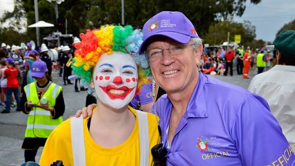 Brian Gilbertson with one of the pageant clowns – his daughter Brigette.