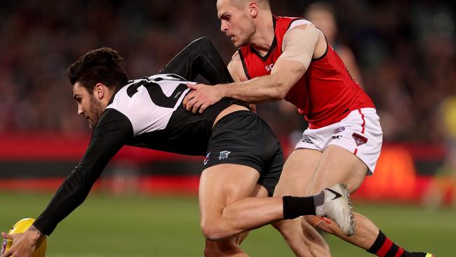 Chad Wingard of the Power is tackled by David Zaharakis of the Bombers in the round 23 clash at Adelaide Oval. Picture: Getty Images