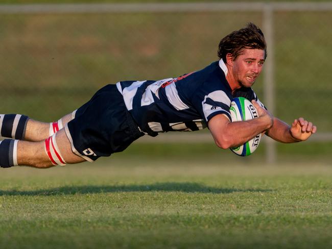 Darwin A-grade Rugby Union Round 1: Darwin Dragons v Casuarina Cougars. Marty Strachan from the Cougars makes a try right before half-time.Picture: Che Chorley