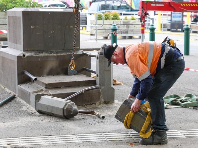 The statue had been cut from its plinth and appeared to have also been cut in half. Picture: Brendan Beckett