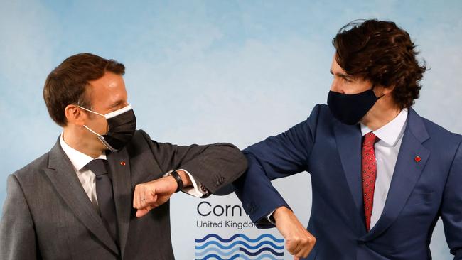 France's President Emmanuel Macron greets Canada's Prime Minister Justin Trudeau. Picture: AFP