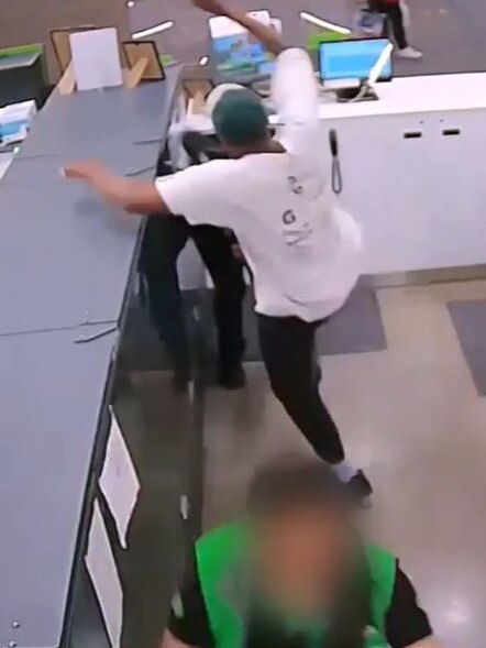 This customer jumped a counter to attack a worker.