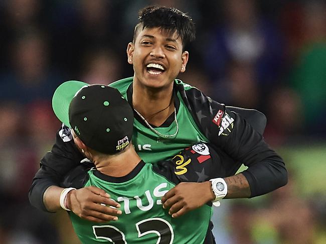 CANBERRA, AUSTRALIA - DECEMBER 21: Sandeep Plamichhane of the Stars celebrates with team mates after taking the wicket of Shane Watson of the Thunder during the Sydney Thunder v Melbourne Stars Big Bash League Match at Manuka Oval on December 21, 2018 in Canberra, Australia. (Photo by Brett Hemmings/Getty Images)