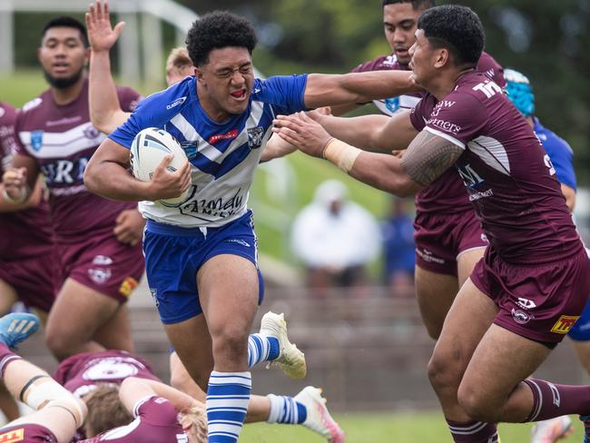 Bulldog Paul Alamoti breaks through the Manly defence. Picture: Julian Andrews.