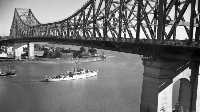 The H.M.A.S. Gladstone sails under the Story Bridge after arriving Brisbane. Picture by Ray Saunders The Courier-Mail Photo Archive.