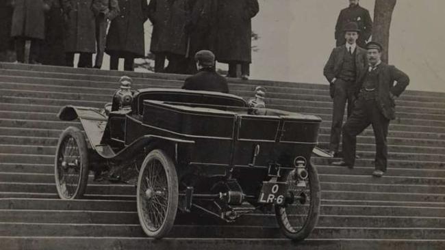 Lanchester test driver Archie Millership drives the 10hp Lanchester car up the steps in front of the Crystal Palace in 1904.