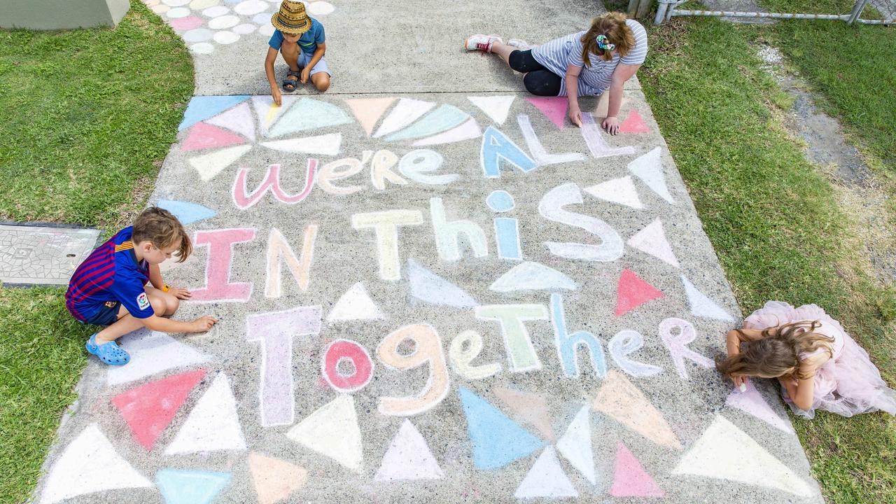 Young artists in a Cannon Hill, Qld, driveway. Picture: AAP