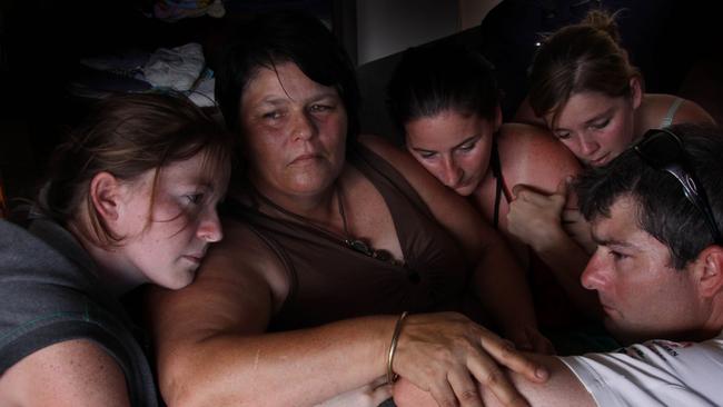 Tammy Bradey in 2009 is comforted by her children, Patricia Bradey, Katrina Bradey, Cheyanne Bradey and Lindsay Bradey after the senseless loss of her son Jaxon Bradey, who was in the wrong place at the wrong time.