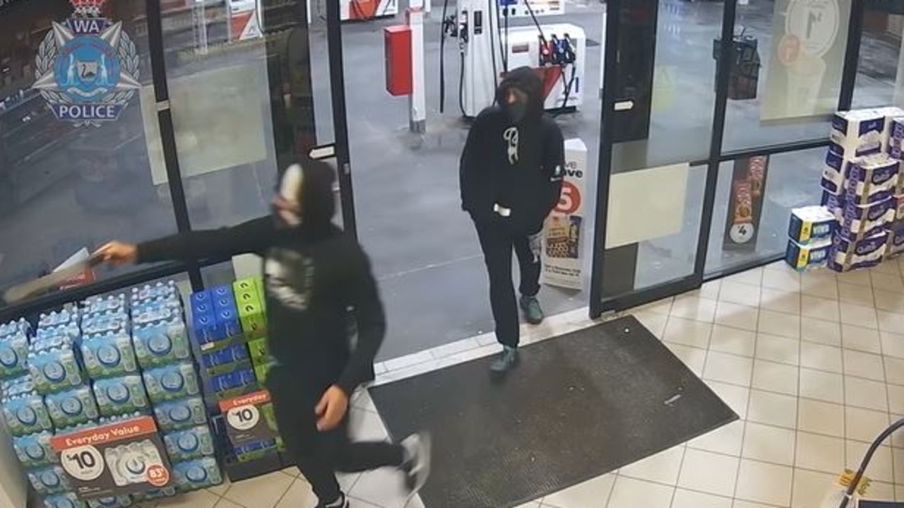 One of the men was seen entering the store while carrying a large knife. Picture: WA Police