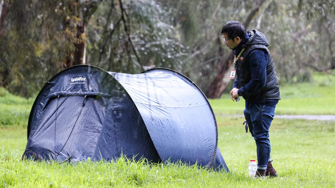 Code blue outreach case manager Trung Cao near a tent in the West Parklands. Image/Russell Millard