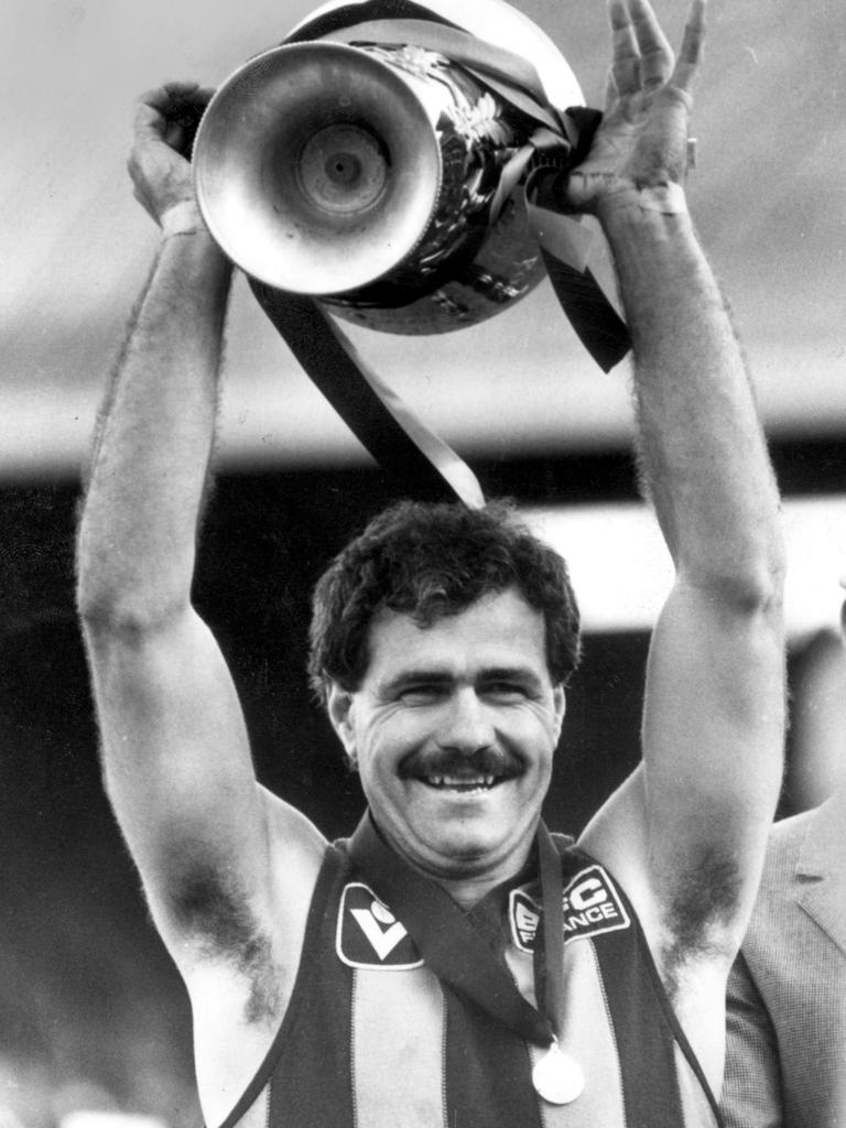 Leigh Matthews with the 1983 VFL premiership cup.