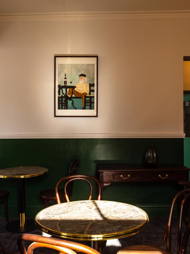 Hampden Bar &amp; Bistro’s main dining room which is decorated with vintage French posters and soothing hues of deep green. Picture: Sammy Jones Photography