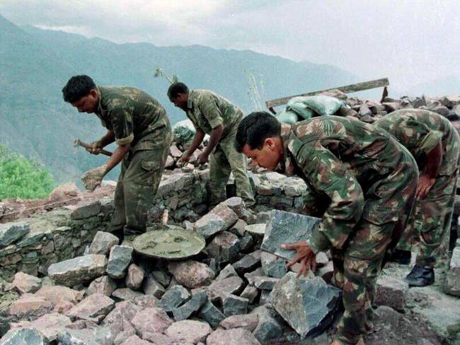 Indian soldiers strengthen their positions adjoining the Line of Control in Kashmir in 1998.