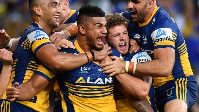 Oregon Kaufusi celebrates a try with his Eels teammates. Picture: AAP