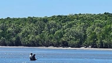 A couple of keen anglers flirting with waters notorious for crocodile activity. Picture: Landbased Barramundi Fishing Darwin