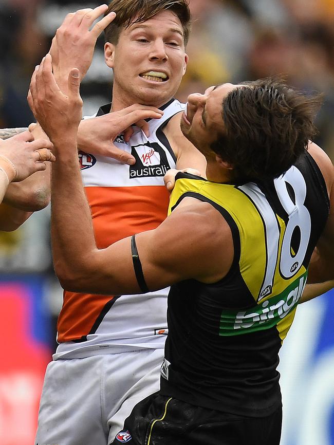 Toby Greene makes contact with Alex Rance. Picture: AAP