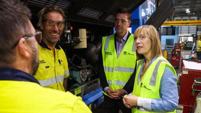 The NSW Transport Minister Jo Haylen and independent MP for Wakehurst, Michael Regan, speak with mechanic apprentice Brad Walker and other employees at the workshop in the Keolis Downer bus depot at Brookvale in May, 2023. Picture: NSW Government