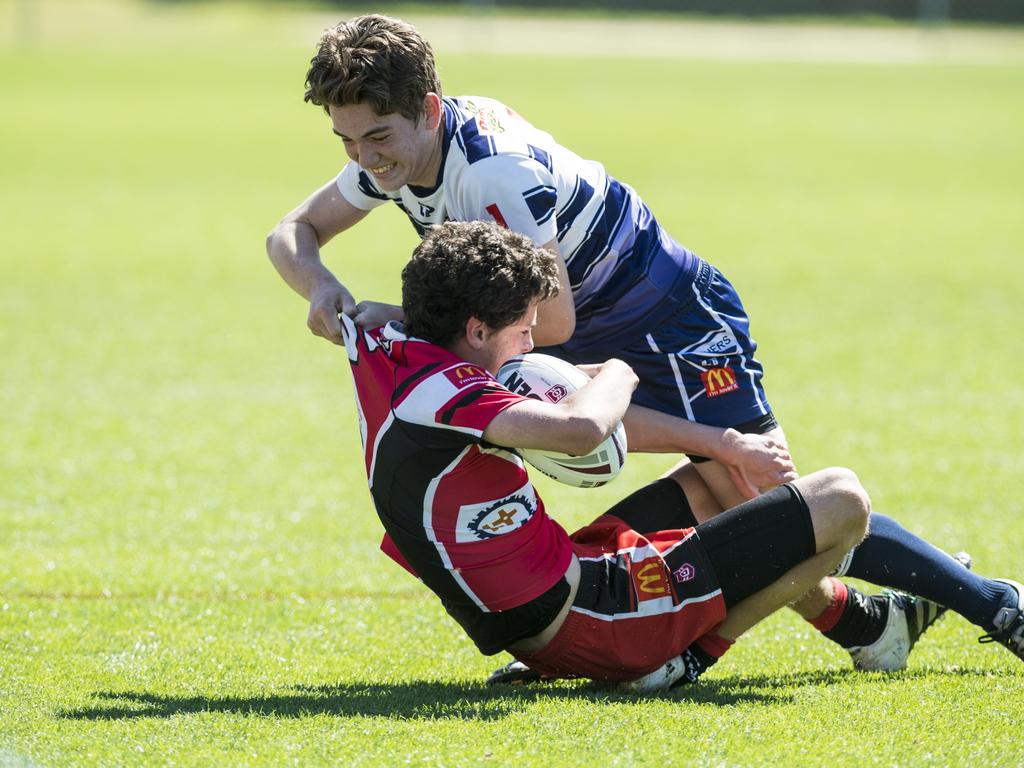 Ash Messenger of Brothers attempts to drag Aleksander Bradley of Valleys into touch in under-13 boys Toowoomba Junior Rugby League grand final at Clive Berghofer Stadium, Saturday, September 11, 2021. Picture: Kevin Farmer