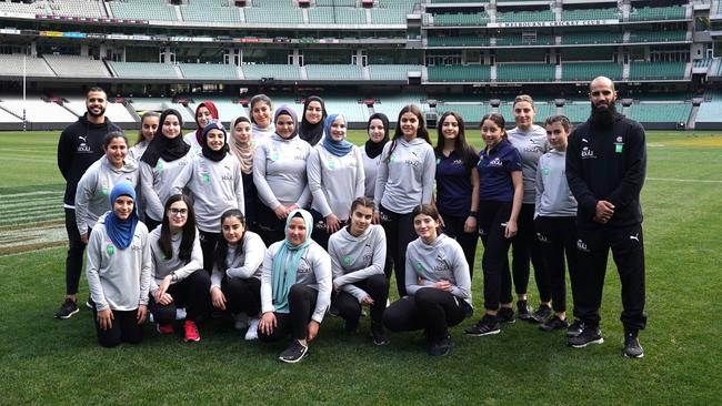 Bachar Houli with participants of the Bachar Houli Girls Leadership Program at the Bachar Houli Foundation and MCC Foundation partnership launch at the MCG in July. Picture: Sean Garnsworthy