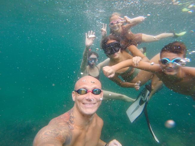 Michael Klim snorkelling with his family.