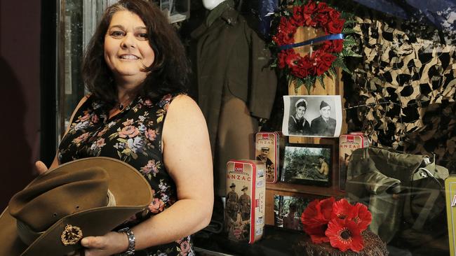 Amanda Rhodes with her annual Anzac Day tribute in the front window of Passion Flower in Glenorchy. Picture: MATHEW FARRELL