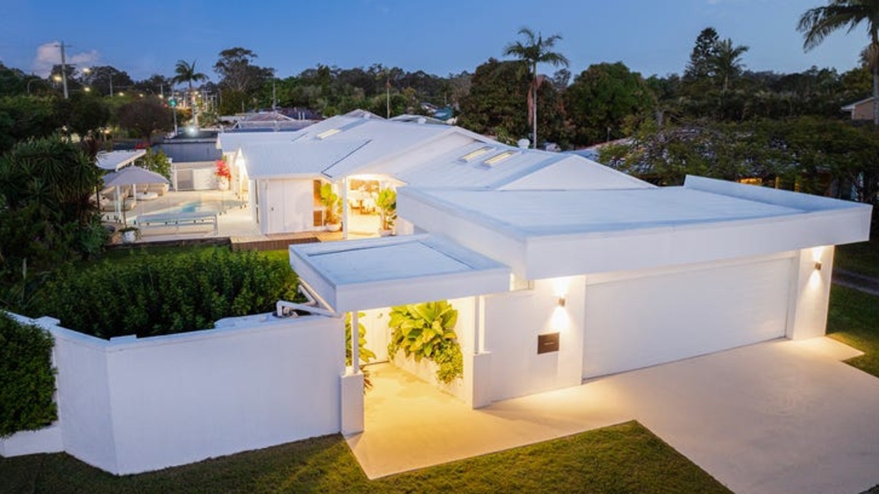 The Nerang home stands out with its bright white exterior