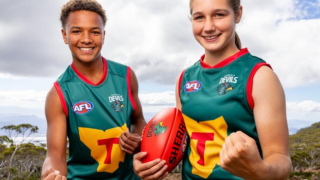 Shaun Kongwa and Mia Barwick sporting the new Tasmania Devils jumpers. Picture: Linda Higginson / Tasmania Football Club