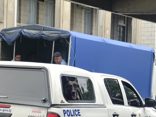 Police swarm the prison truck John Nikolic was transported in, searching for drugs. Picture: News Corp Australia 